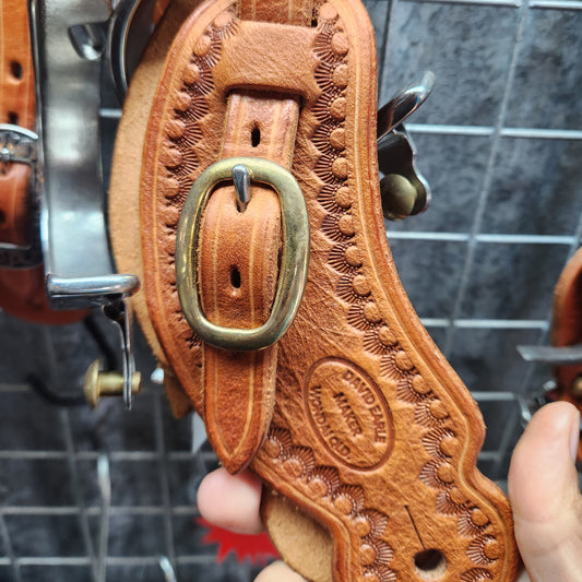 Spur straps tooled